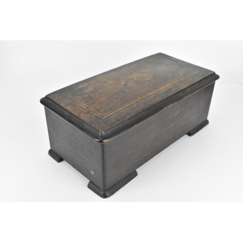 234 - A Victorian rosewood cylinder music box, the lid inlaid with stringing and central marquetry decorat... 