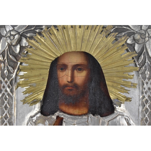 238 - A 19th century Russian icon of Christ Pantocrator, with brass and plated copper oklad, 27 cm x 22 cm