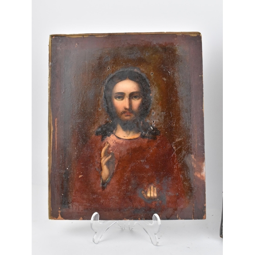 239 - A Russian silver plated copper icon of the Crucifixion of Christ, entirely cast relief of thin sheet... 