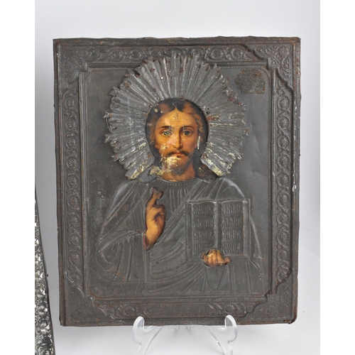 239 - A Russian silver plated copper icon of the Crucifixion of Christ, entirely cast relief of thin sheet... 