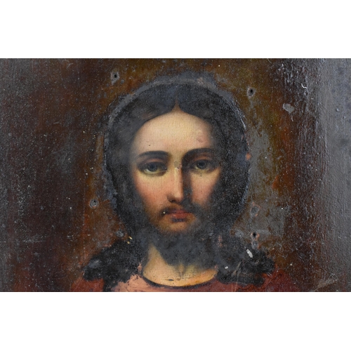 239 - A Russian silver plated copper icon of the Crucifixion of Christ, entirely cast relief of thin sheet... 