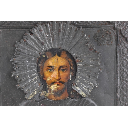 239 - A Russian silver plated copper icon of the Crucifixion of Christ, entirely cast relief of thin sheet... 