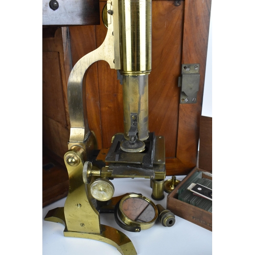 246 - A 19th century brass microscope by Salmon (100 Fenchurch St., London) in a mahogany box with brass f... 