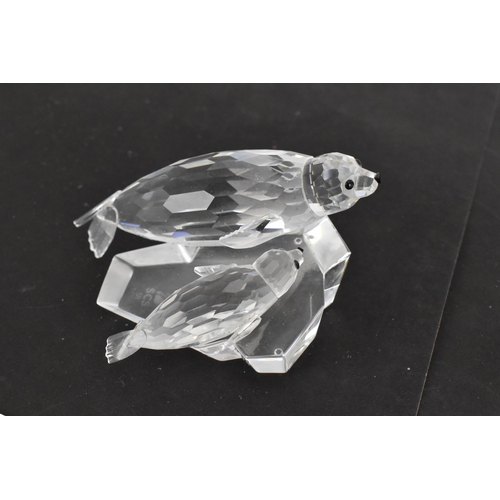 261 - A collection of Swarovski crystal CSC annual edition animal models, comprising a group of dolphins '... 
