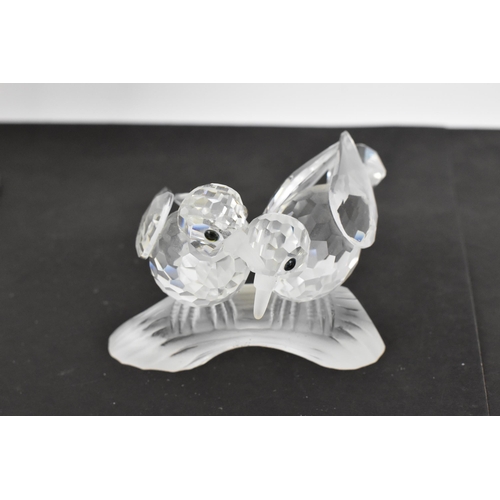 261 - A collection of Swarovski crystal CSC annual edition animal models, comprising a group of dolphins '... 