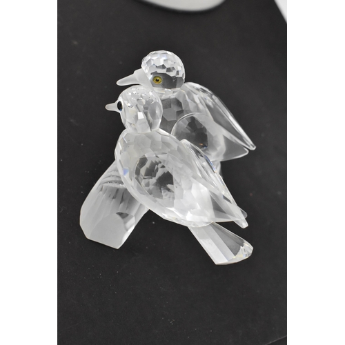 261 - A collection of Swarovski crystal CSC annual edition animal models, comprising a group of dolphins '... 