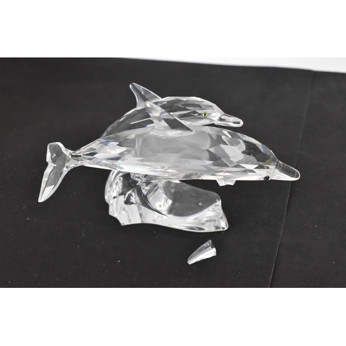 261 - A collection of Swarovski crystal CSC annual edition animal models, comprising a group of dolphins '... 