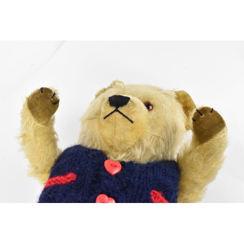 127 - A vintage Chiltern Ting-a-Ling teddy bear circa 1950's with orange and black eyes, short mohair muzz... 