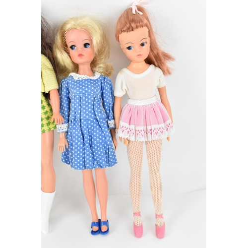 217 - A collection of four 1960s/70s Sindy dolls, in various outfits to include 'Ballet', 'Trendy', 'Bedti... 