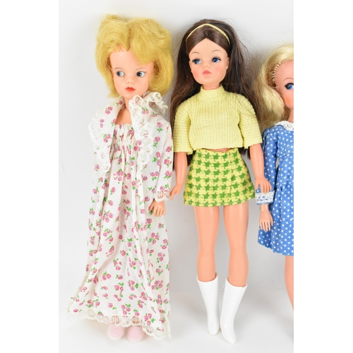 217 - A collection of four 1960s/70s Sindy dolls, in various outfits to include 'Ballet', 'Trendy', 'Bedti... 
