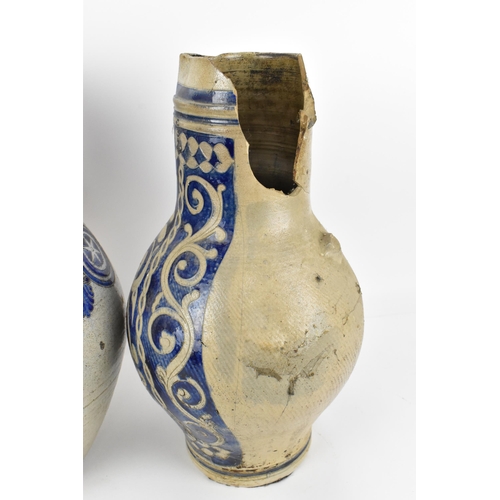 277 - Two German salt-glazed blue and white flagons, probably  18th century Westerwald, each of bulbous fo... 