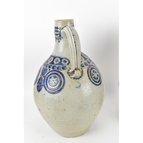 277 - Two German salt-glazed blue and white flagons, probably  18th century Westerwald, each of bulbous fo... 