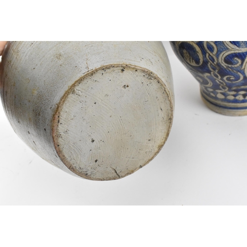 277 - Two German salt-glazed blue and white flagons, probably  18th century Westerwald, each of bulbous fo... 