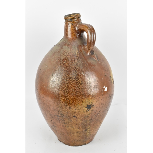 278 - A large German stoneware Bellarmine Bartmannskrug flagon, salt glazed, 17th century, with bearded ma... 