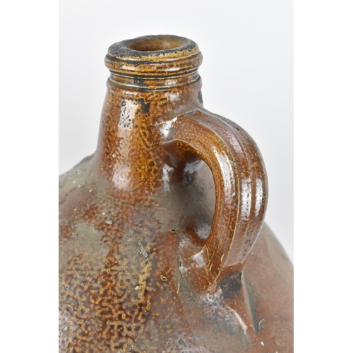 278 - A large German stoneware Bellarmine Bartmannskrug flagon, salt glazed, 17th century, with bearded ma... 