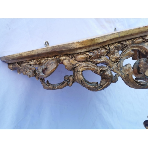 114 - A 19th century giltwood and marble console table and mirror, the table with shaped white marble top,... 