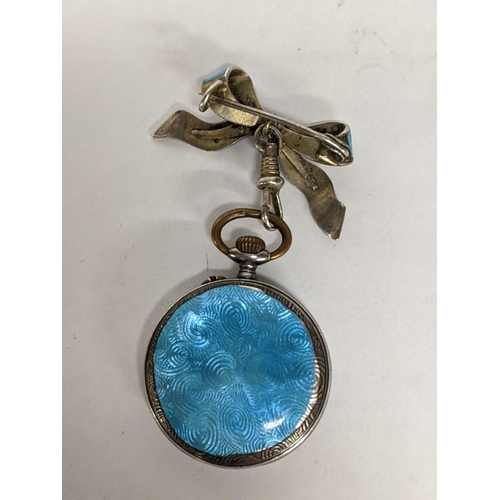 16 - A late 19th/early 20th century silver enamelled fob watch suspended on a matching bow brooch A/F
Loc... 