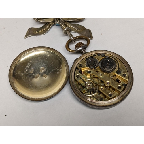 16 - A late 19th/early 20th century silver enamelled fob watch suspended on a matching bow brooch A/F
Loc... 