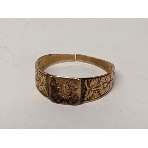 17 - A 9ct gold ring engraved with floral decoration, 2.2g
Location: RING