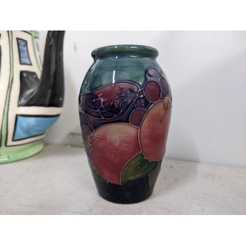 208 - 20th century collectable ceramics to include a Moorcroft birds and fruit pattern vase and two tea po... 