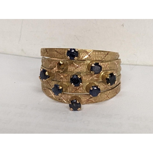 29 - An 18ct gold ring having eight sapphires (one missing) stamped 18k, 3.6g
Location: RING