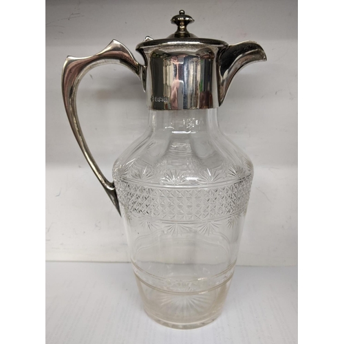 35 - An Edwardian cut glass claret jug having a silver top and handle, hallmarked Sheffield 1910
Location... 