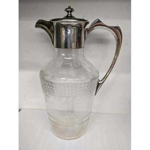 35 - An Edwardian cut glass claret jug having a silver top and handle, hallmarked Sheffield 1910
Location... 