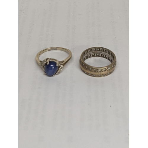 37 - A ring stamped with 10k set with a blue stone and diamonds together with a 9ct ring set with white s... 