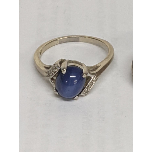 37 - A ring stamped with 10k set with a blue stone and diamonds together with a 9ct ring set with white s... 