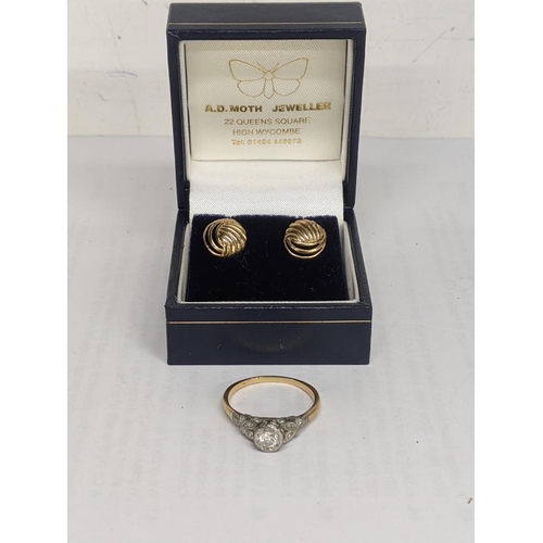 40 - A yellow metal ring inset with a diamond, together with a pair of 9ct gold earrings, total weight 4.... 