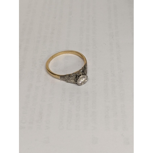 40 - A yellow metal ring inset with a diamond, together with a pair of 9ct gold earrings, total weight 4.... 