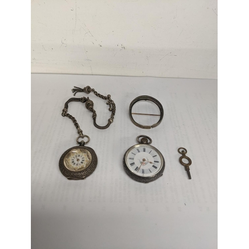 41 - A late 19th century silver fob watch, a pocket watch chain, and a key, together with a 19th century ... 