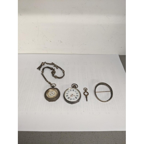 41 - A late 19th century silver fob watch, a pocket watch chain, and a key, together with a 19th century ... 