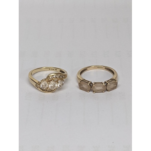 50 - A 14ct gold ring set with white stones, together with a 9ct gold ring inset with paste stones, total... 