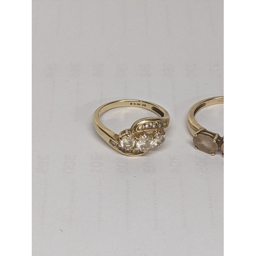 50 - A 14ct gold ring set with white stones, together with a 9ct gold ring inset with paste stones, total... 