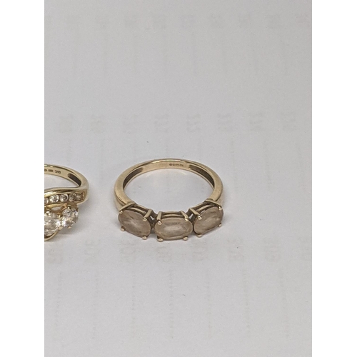 50 - A 14ct gold ring set with white stones, together with a 9ct gold ring inset with paste stones, total... 