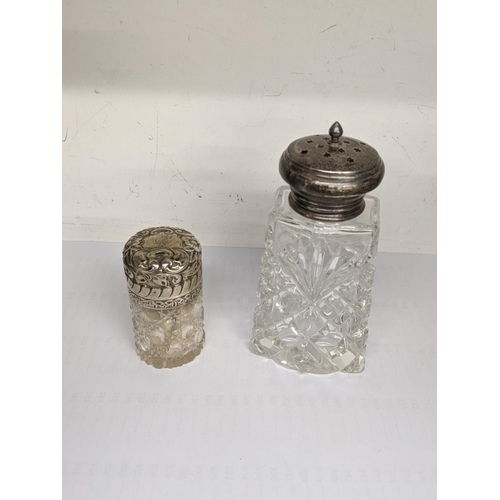 57 - Silver to include a smelling salts jar, a sugar caster, glove stretchers, curling tongs and a shoe h... 