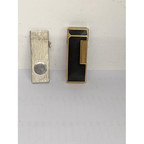 59 - A Dunhill lighter together with silver cigar cutter, hallmarked Birmingham 1991
Location: CAB6