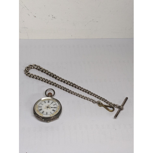 60 - A silver cased, open face fob watch having Roman numerals and blued hands together with a silver wat... 