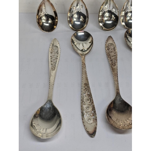 63 - Twelve silver teaspoons having a coiled central design, total weight 185.4g
Location: TABLE