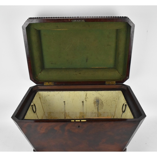 130 - A Regency style sarcophagus shaped mahogany cellerette, with gadrooned hinged top opening tin liner ... 