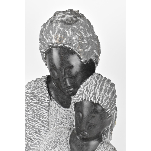204 - Bernard Sakarombe (XX-) Zimbabwean, 
'Proud Parents', carved springstone figural sculpture, 61 cm hi... 