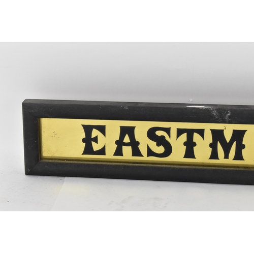 267 - A vintage glazed advertising sign for 'Eastmans pure tea',  with black lettering on gilt ground, in ... 