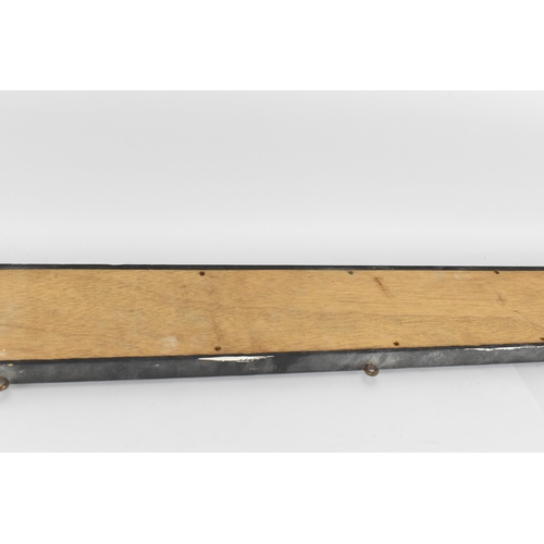 267 - A vintage glazed advertising sign for 'Eastmans pure tea',  with black lettering on gilt ground, in ... 