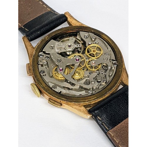 85 - A mid 20th century 18ct gold, chronograph manual wind, gents wristwatch, having a silvered dial with... 