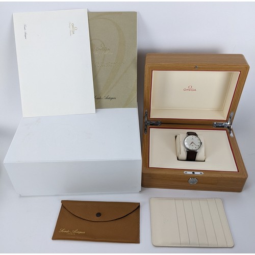 89 - A Omega manual wind gents wristwatch, circa 1958, having a white enamel dial with gilt applied hour ... 