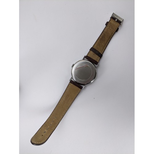 89 - A Omega manual wind gents wristwatch, circa 1958, having a white enamel dial with gilt applied hour ... 