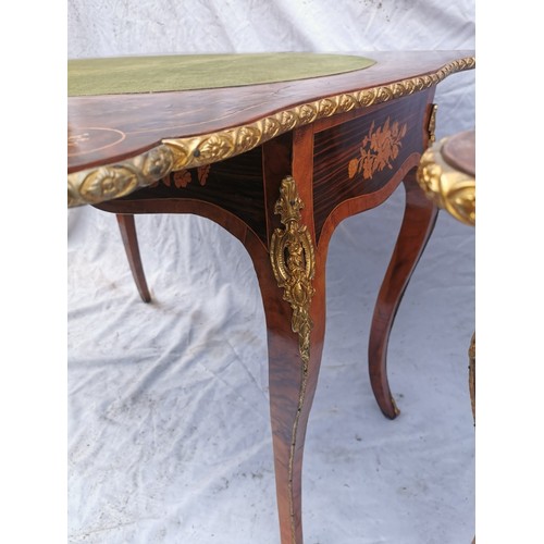 112 - A pair of 20th century walnut and marquetry card tables, the folded tops with eared corners mounted ... 