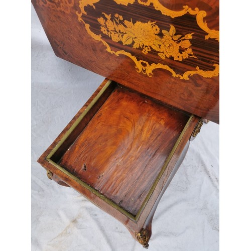 112 - A pair of 20th century walnut and marquetry card tables, the folded tops with eared corners mounted ... 