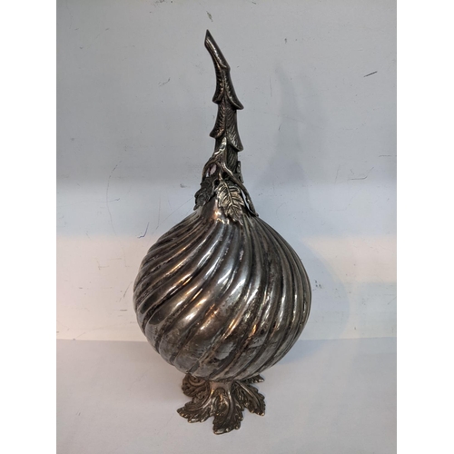 213 - A white metal Turkish rose water sprinkler having a bulbous body and fashioned as a stylised fig fru... 